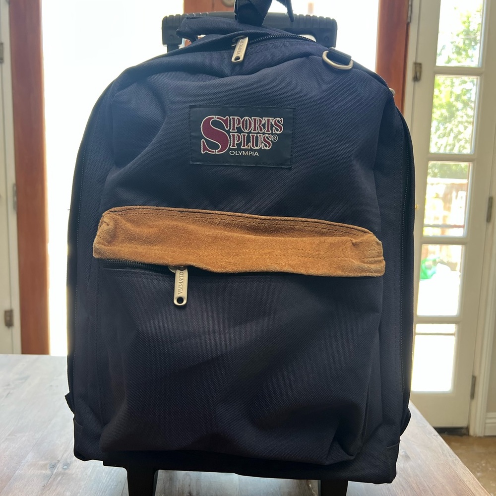 Navy and Tan rolling backpack